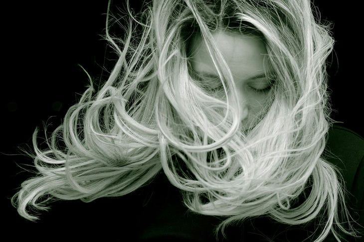 How to Stop Split Hair: Helpful Tips young woman